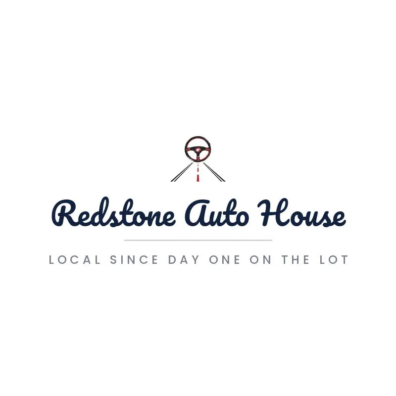 Brush painted dealership logo with a steering wheel over a road