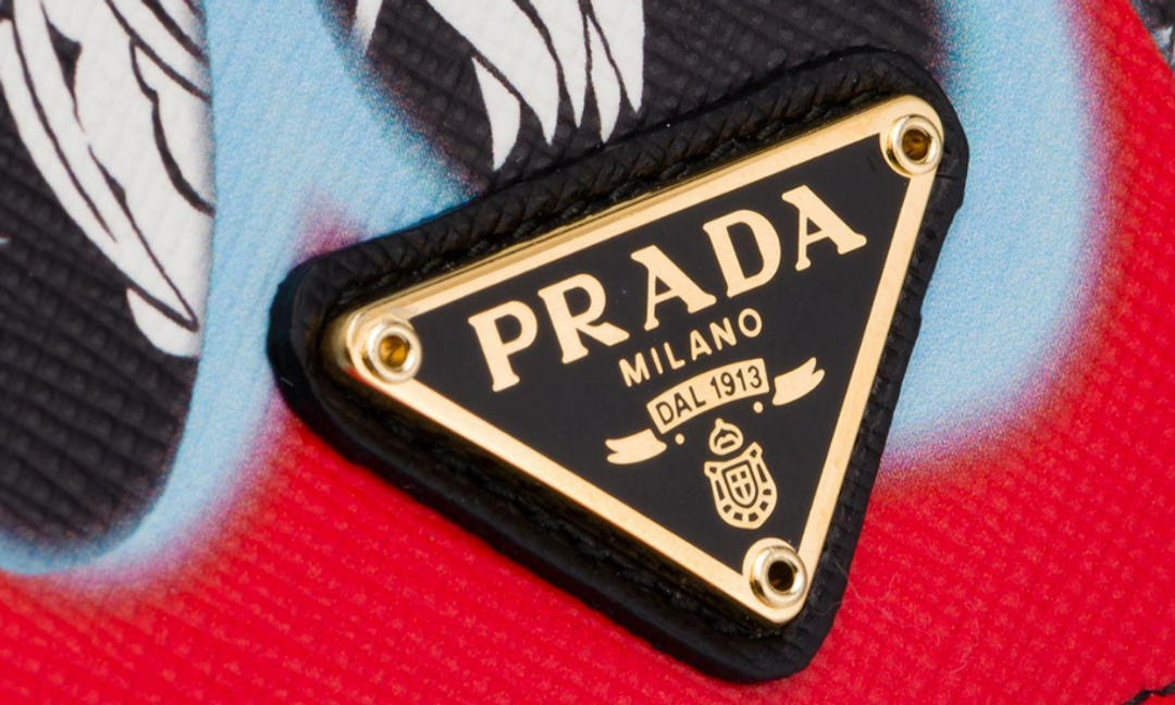 Prada's logo with the royal coat of arms and crown | Source