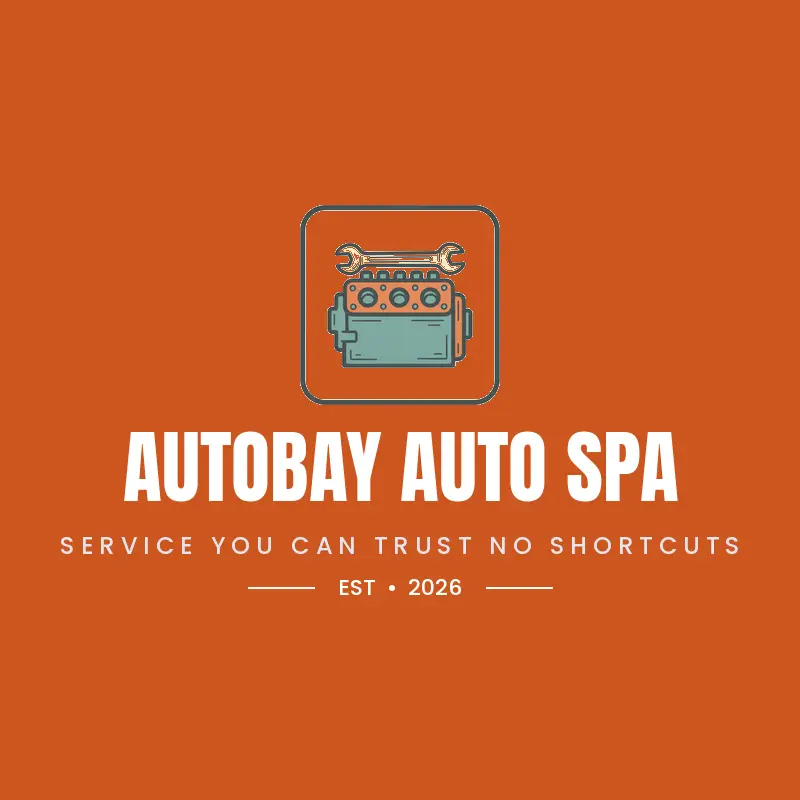 A bold ink engine and wrench mark on orange inside a frame for an auto repair shop.